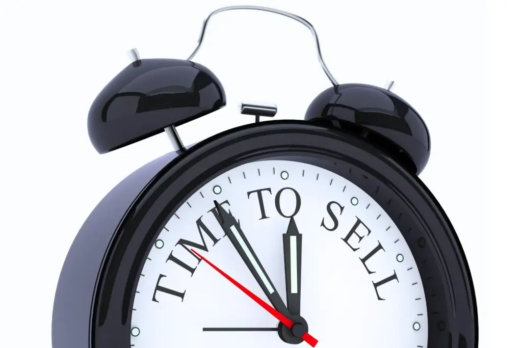 Clock telling you when its time to sell your business written on the face